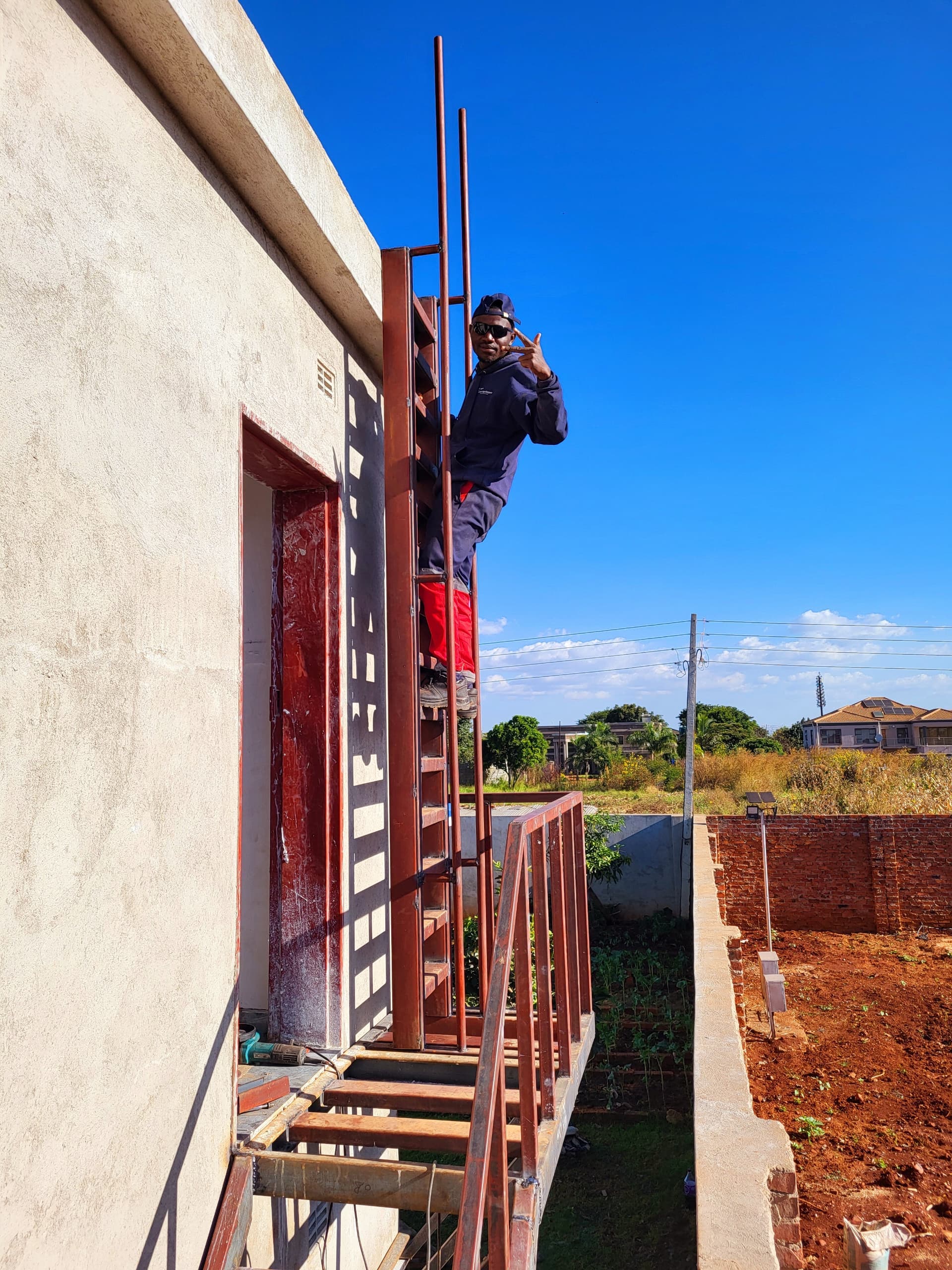 Daniel Muronzi working on a ladder project