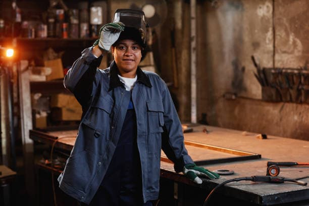 Professional welder in workshop